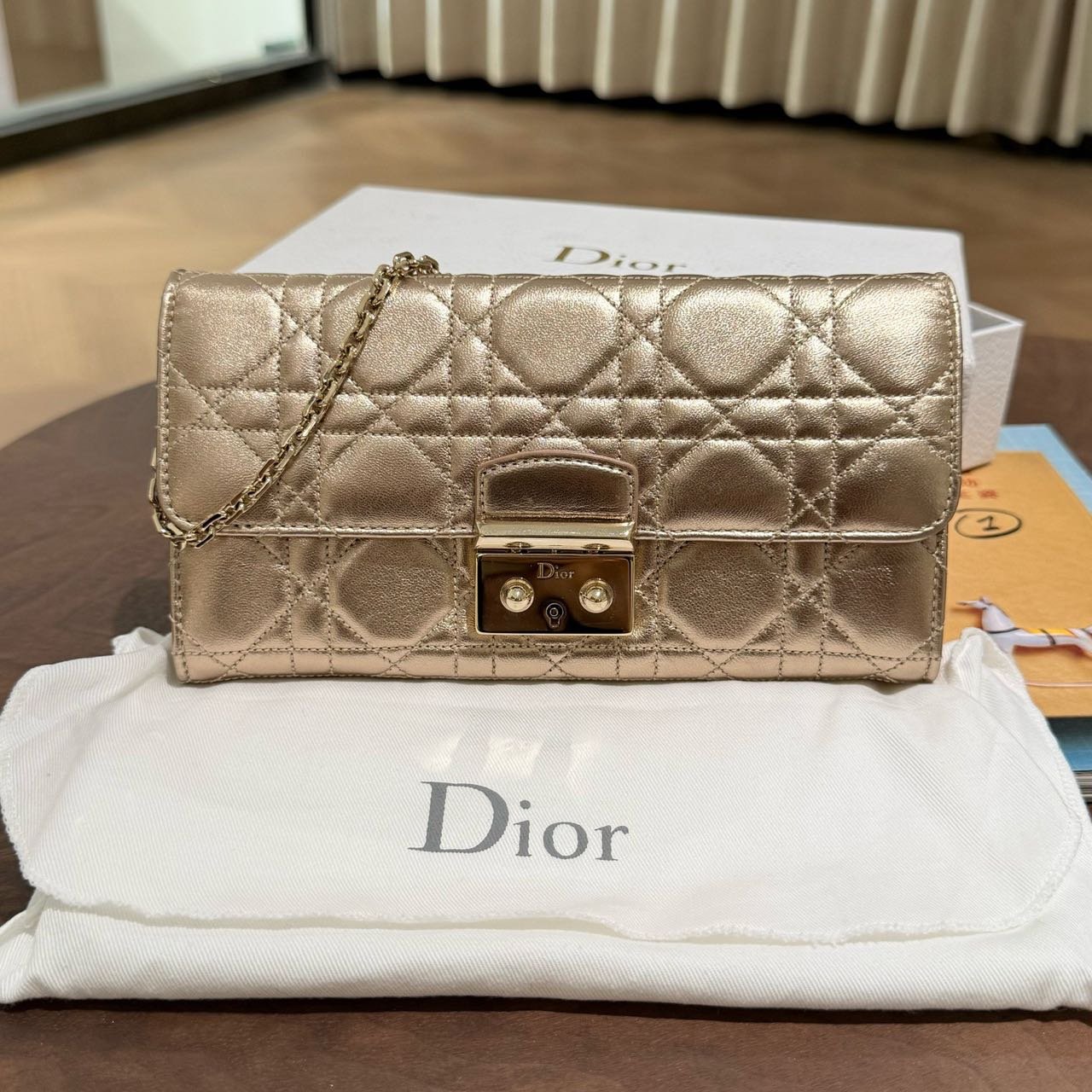 223ee6c26a5a424f1df2c0871c29c95f Dior Champagne‑gold lambskin 5‑grid WOC chain bag - Image 1